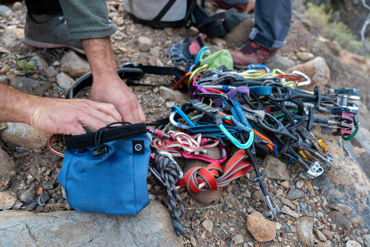 Traditional climbing gear arranged on rocky terrain