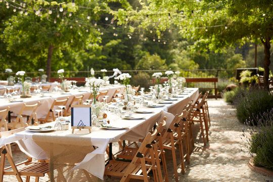 Outdoor wedding table setting with floral decor