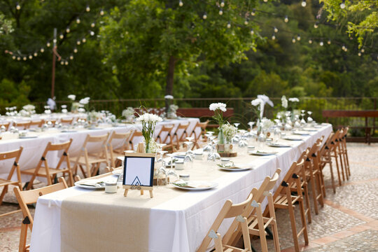 Outdoor wedding reception with elegant white decor