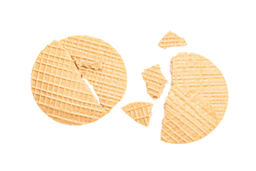 a broken waffle cookie on a white surface