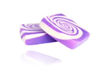 two soap bars with swirl designs on them