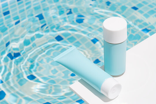 Cosmetics by the pool with summer blue packaging