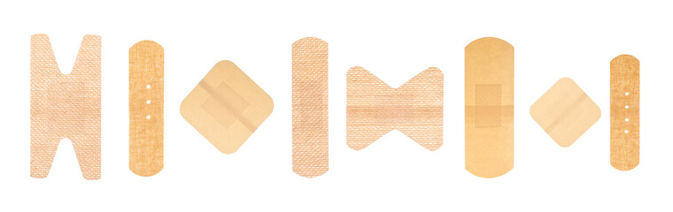 Collection of different adhesive bandage plasters isolated on a white background, top view.