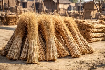 Clay house with golden rice straw bundles high resolution picture