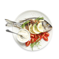 Tasty roasted dorado fish with sauce, tomatoes and lemon isolated on white, top view. Homemade seafood dish