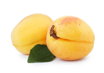 Fresh ripe apricots with green leaf isolated on white