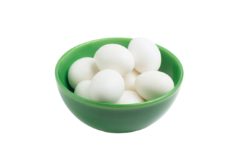 a green bowl filled with eggs on top of a white table