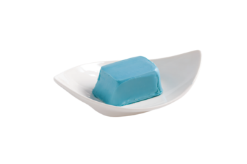 a blue soap bar in a white bowl