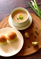 Delicious Cream of Chicken Mushroom Soup Paired with Bread Roll