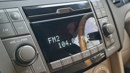 Fototapeta premium A close-up of a car radio, displaying 