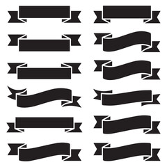 Two male soccer players in silhouette actively engaged in a competitive match dribbling and kicking a soccer ball during a game