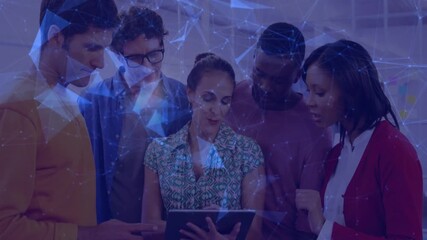 Woman tapping tablet and guiding team toward business insights while network overlay intensifying - Powered by Adobe