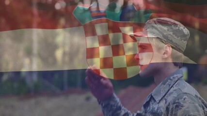 Service member lifting hand to cap saluting lowering in military tribute with Croatian flag overlay - Powered by Adobe