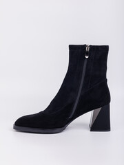 Discover the perfect blend of style and comfort with these Stylish Black Suede Ankle Boots, featuring a unique Geometric Heel Design that caters to the tastes of modern fashion enthusiasts everywhere