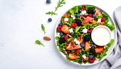 Colorful salad with berries and nuts