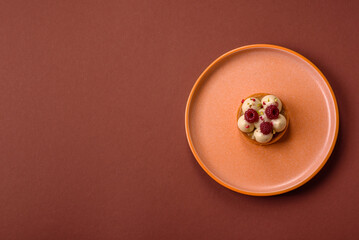 Sweet cake or tart round with cream and raspberries. Raspberry sweet tart