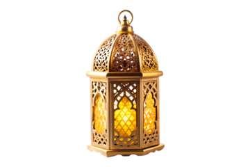 Photo of an ornate gold lantern with intricate patterns and a warm yellow glow sits isolated on a transparent background