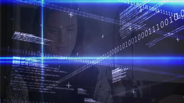 Woman opening laptop and typing while developing software, binary code shifting under blue bars