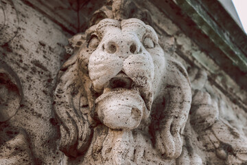 Close-up of stone lion's head decorating Vittorio Emanuele II Bridge over Tiber River in Rome,...