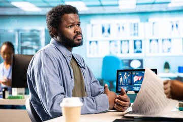 Medical consultation featuring a doctor advising a young man on diagnostics and treatment,...