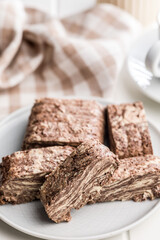 Halva with cocoa. Sweet oriental dessert on plate.