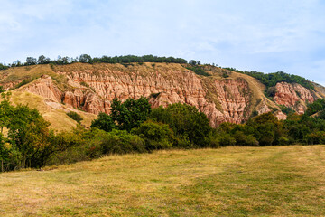Red Ravine, Romania's little canyon, a geological and botanical reserve, a natural monument located in the extreme southwest of the Secaşelor Plateau on the right bank of the Secașul Mare