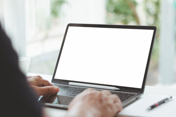 Businessman using laptop with blank white screen at home office, hand typing keyboard, mockup design, advertising, website presentation, online marketing, digital business, modern technology lifestyle