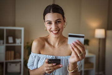 beautiful woman use mobile phone and credit card for online shopping
