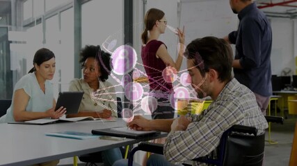 Business team tapping tablet and typing keys while network graphic animating to show data flow - Powered by Adobe