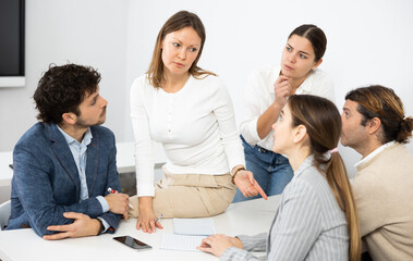 Team building for employees discussing problems of work, feeling psychological support during...