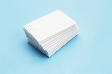 Facial tissue on blue background.