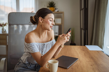 beautiful woman text messages or explore internet on mobile phone