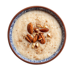 Healthy porridge in bowl with nuts, almonds and cinnamon, top view clipart