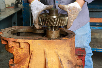 Dirty and broke Differential gear hub assembly need service on the floor.
