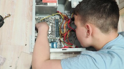 technician hold the screwdriver for repairing the laptop. computer hardware, repairing, upgrade and technology. professional technicial at workplace concentrated. focus on hands