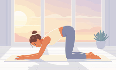 Obraz premium Woman in yoga pose indoors on a mat, with sunlight streaming through the window, creating a peaceful and healthy atmosphere.