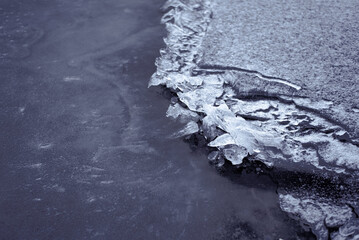 Broken Ice on Frozen Lake or River in Cold Weather