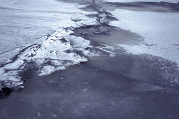Broken Ice on Frozen Lake or River in Cold Weather