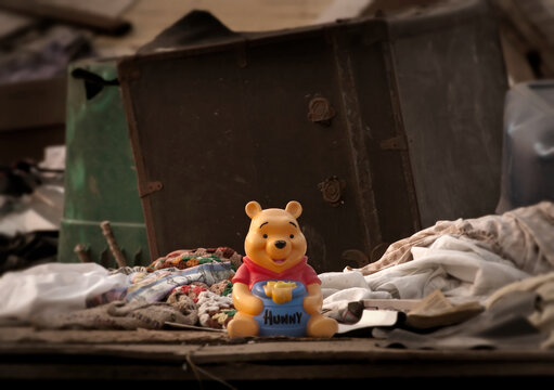 Child's Winnie the Pooh toy sits among debris after April 27, 2011 EF4 tornado in Tuscaloosa Alabama