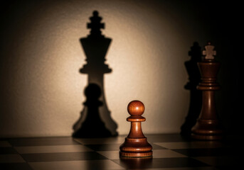 Wooden pawn on a chessboard with shadows of kings. A dramatic shot conveying strategy and power. Strategic advantage, game of skill, leadership challenge.