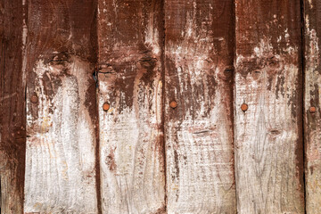 Brown and white wood fence close-up texture details.