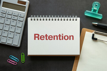 There is notebook with the word Retention. It is as an eye-catching image.