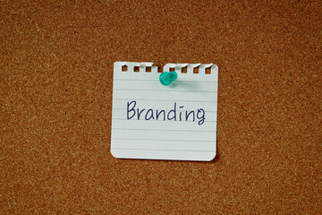 There is a piece of paper with the word Branding. It is as an eye-catching image.