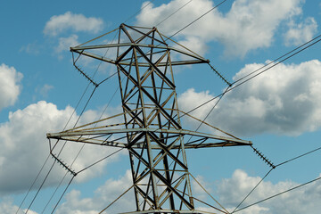Fragment of a high-voltage tower guy wire with insulators