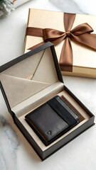 A stylish black leather wallet is presented inside an elegant gift box, alongside a golden ribboned present, ideal for showcasing luxurious gifts and accessories.