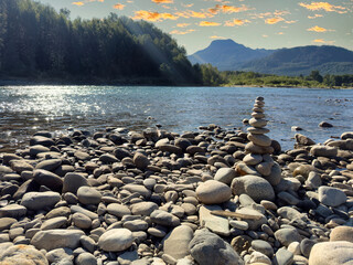Rock tower on the Skagit river in Washington state cascades during the middle of summer on a lovely sunrise morning