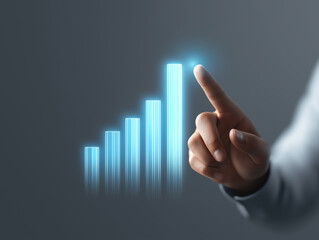 Business growth chart with hand pointing at highest bar