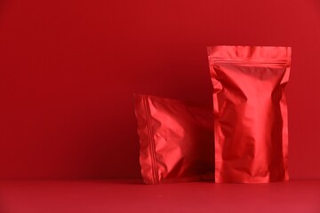 Zipper stand-up pouches on red background. Mockup for design
