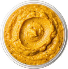 Fototapeta premium Top view of vibrant yellow hummus swirled in a clear plastic container isolate