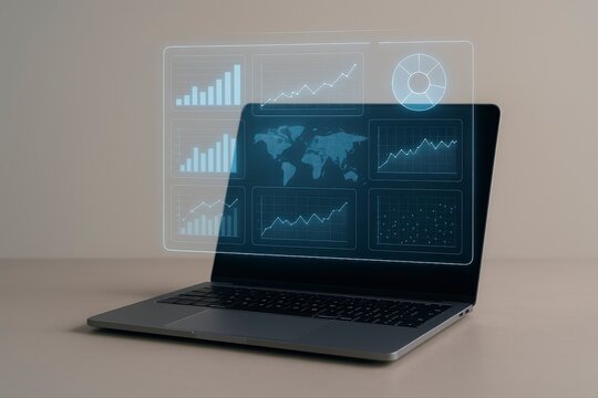 Laptop displays financial data charts and world map for global business analytics analysis and technology